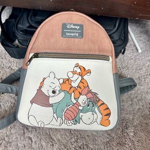 Winnie the Pooh and Friends Loungefly backpack and wallet